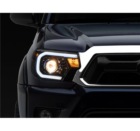 Raxiom 12-15 Toyota Tacoma Axial Series Projector Headlights w/ LED Bar- Blk Housing (Clear Lens)