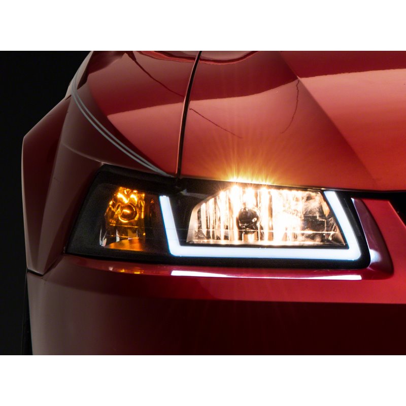 Raxiom 99-04 Ford Mustang Axial Series Headlights w/ LED Bar- Blk Housing (Clear Lens)