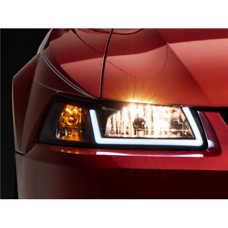 Raxiom 99-04 Ford Mustang Axial Series Headlights w/ LED Bar- Blk Housing (Clear Lens)